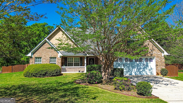 view of front facade featuring concrete driveway, brick siding, and fence