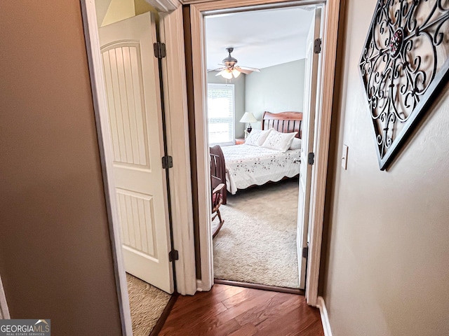 hall with wood finished floors