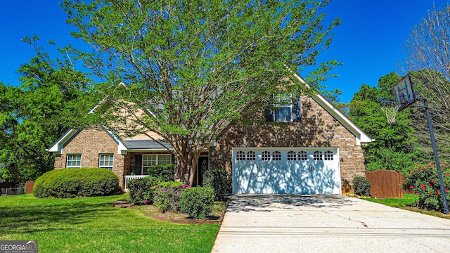 traditional-style home featuring brick siding, a front lawn, fence, and driveway