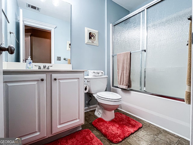 full bathroom featuring visible vents, toilet, enclosed tub / shower combo, vanity, and tile patterned floors
