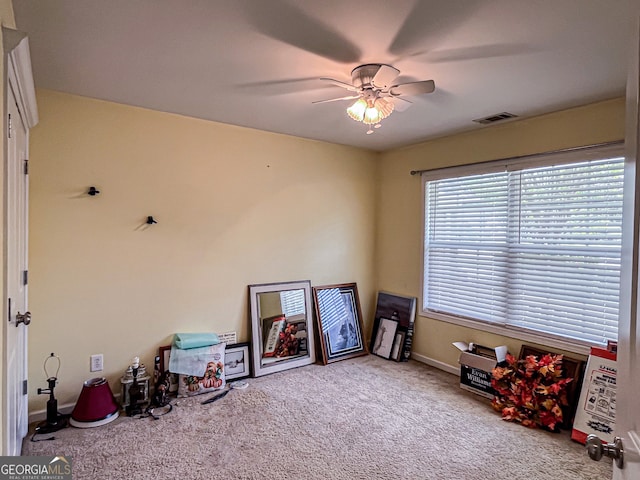 playroom featuring carpet flooring, baseboards, a ceiling fan, and visible vents