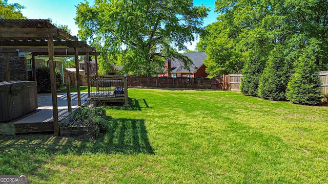 view of yard with a pergola, a fenced backyard, and a wooden deck