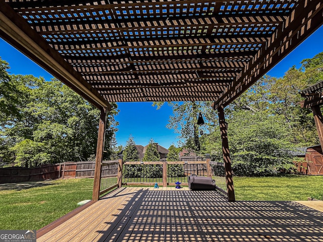 wooden deck with a pergola, a yard, and a fenced backyard