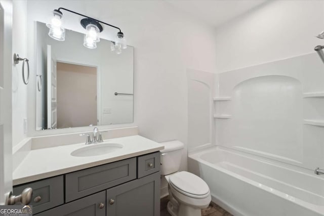 full bath with shower / bathtub combination, vanity, and toilet