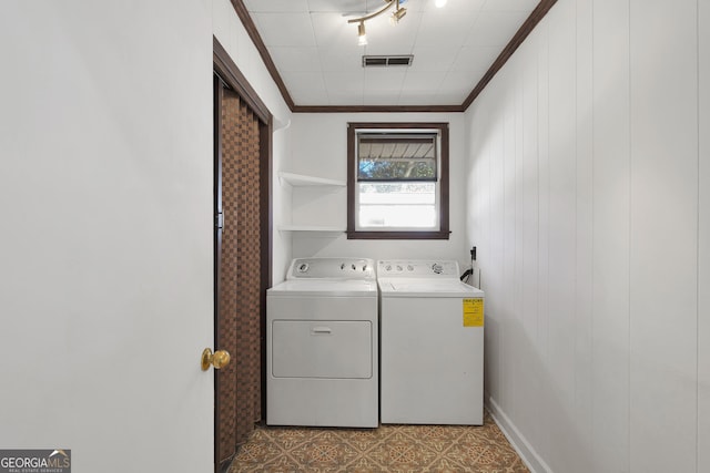 215 Cedar St, Anderson, SC 29626 - washroom featuring laundry area, ornamental molding, visible vents, tile patterned floors, and washing machine and dryer