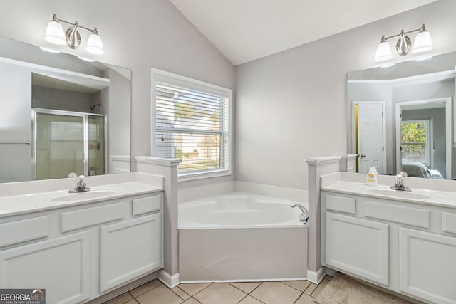 2319 White Alder Dr, Buford, GA 30519 - ensuite bathroom featuring tile patterned floors, vaulted ceiling, a sink, and a stall shower