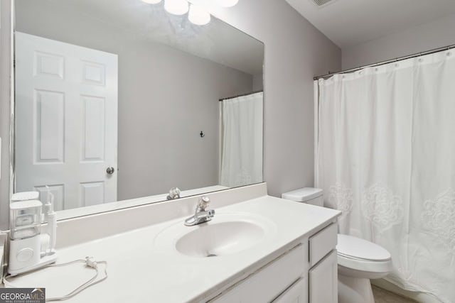 2319 White Alder Dr, Buford, GA 30519 - full bathroom featuring toilet, vanity, and a shower with curtain