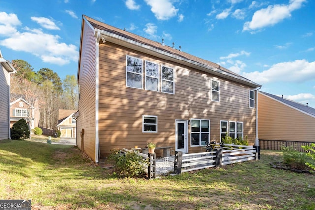 2319 White Alder Dr, Buford, GA 30519 - rear view of house with fence and a lawn