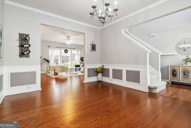 2319 White Alder Dr, Buford, GA 30519 - interior space featuring wood finished floors, ceiling fan with notable chandelier, ornamental molding, and stairway