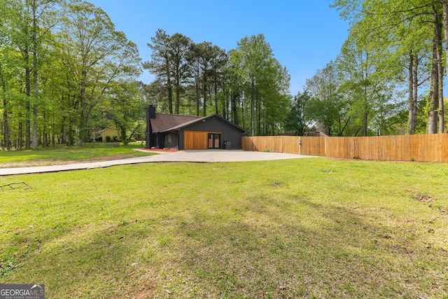 view of yard featuring a patio and fence