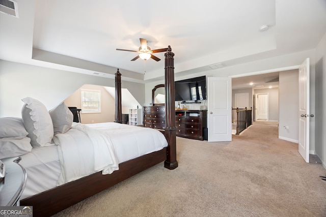 32 Winifred Way, Senoia, GA 30276 - bedroom featuring a tray ceiling, light colored carpet, baseboards, and a ceiling fan