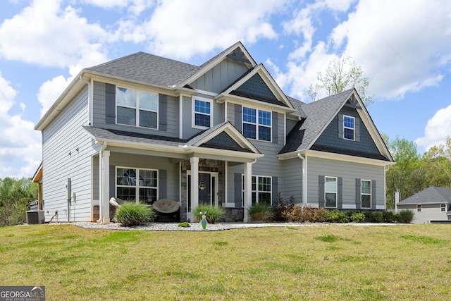 32 Winifred Way, Senoia, GA 30276 - craftsman house featuring a front yard, roof with shingles, and central air condition unit
