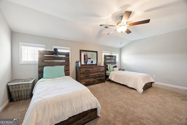 32 Winifred Way, Senoia, GA 30276 - bedroom with carpet flooring, multiple windows, baseboards, vaulted ceiling, and a ceiling fan