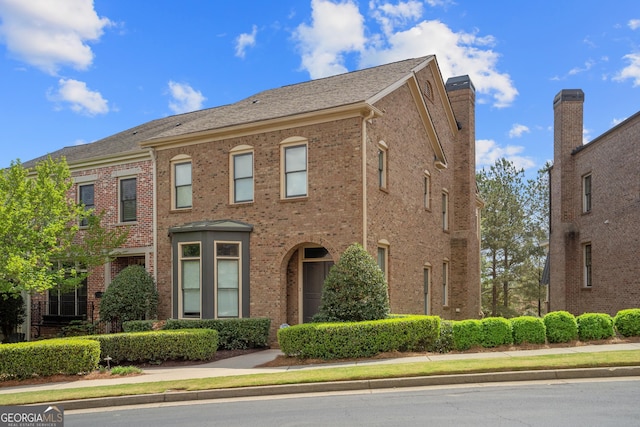 3105 Neal Ct, Cumming, GA 30041 - view of front facade featuring brick siding and a chimney