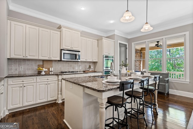 3105 Neal Ct, Cumming, GA 30041 - kitchen with dark wood-type flooring, tasteful backsplash, dark stone countertops, and stainless steel appliances