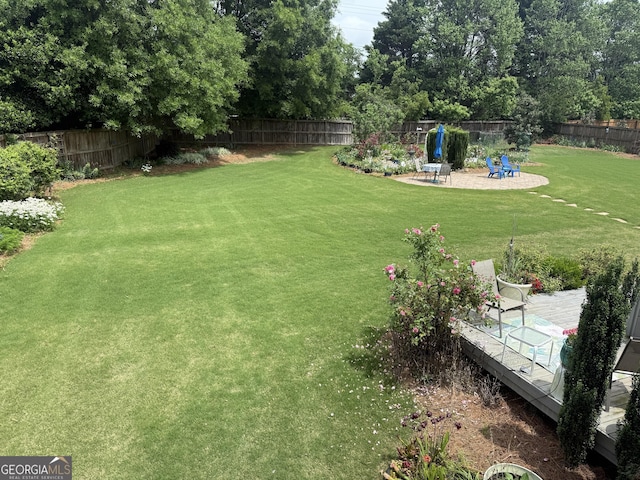 view of yard featuring a patio area and a fenced backyard