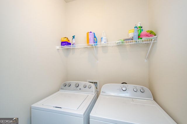 laundry area featuring independent washer and dryer and laundry area