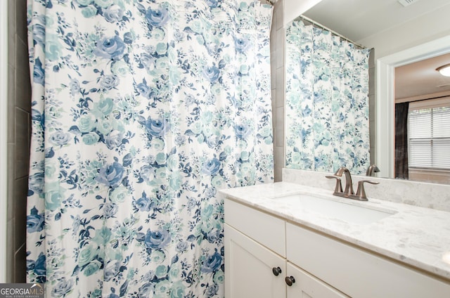 bathroom featuring vanity and a shower with curtain