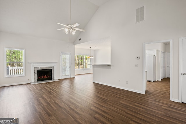 185 Cold Harbor Ct, Sharpsburg, GA 30277 - unfurnished living room featuring visible vents, high vaulted ceiling, a ceiling fan, and dark wood finished floors