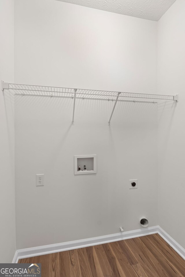 185 Cold Harbor Ct, Sharpsburg, GA 30277 - washroom with baseboards, washer hookup, laundry area, wood finished floors, and electric dryer hookup