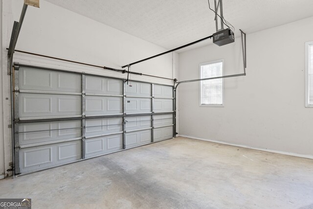 185 Cold Harbor Ct, Sharpsburg, GA 30277 - garage with baseboards and a garage door opener