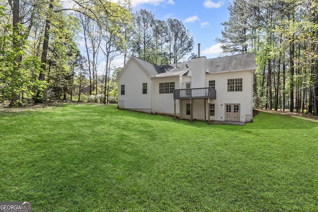 185 Cold Harbor Ct, Sharpsburg, GA 30277 - rear view of property featuring a yard, a wooden deck, and a chimney
