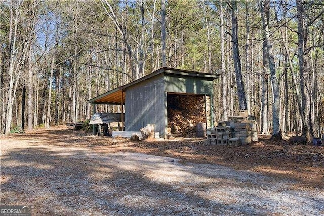 4941 N Helton Rd, Winston, GA 30187 - view of outbuilding with a wooded view and an outbuilding