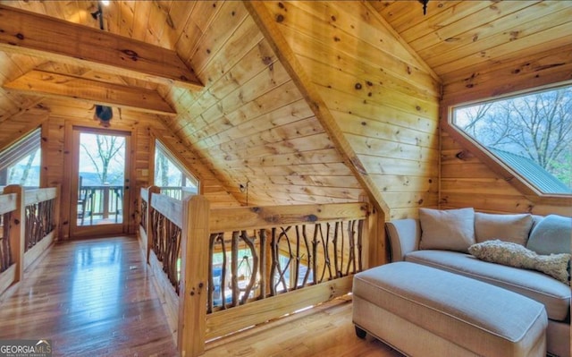 bonus room with wooden walls, wood-type flooring, vaulted ceiling, and wood ceiling