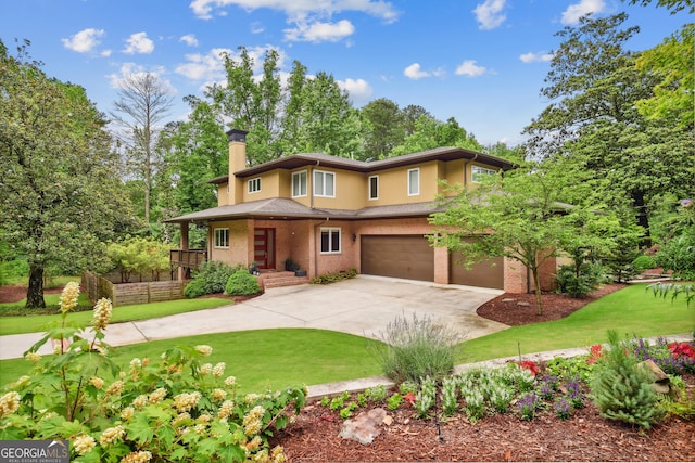 1155 Mcconnell Dr, Decatur, GA 30033 - prairie-style house with a front yard, an attached garage, driveway, and a chimney