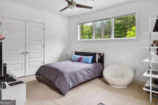 1155 Mcconnell Dr, Decatur, GA 30033 - bedroom with carpet, a closet, a ceiling fan, and crown molding