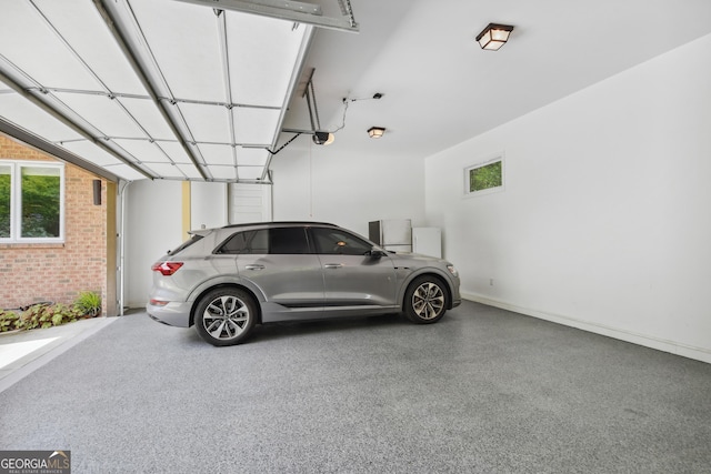 1155 Mcconnell Dr, Decatur, GA 30033 - garage with a garage door opener and baseboards