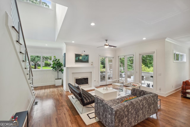 1155 Mcconnell Dr, Decatur, GA 30033 - living area with a fireplace with flush hearth, wood finished floors, and plenty of natural light