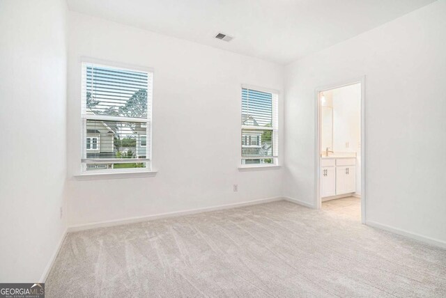 3514 Ambassador Aly, Scottdale, GA 30079 - spare room featuring visible vents, baseboards, and light carpet