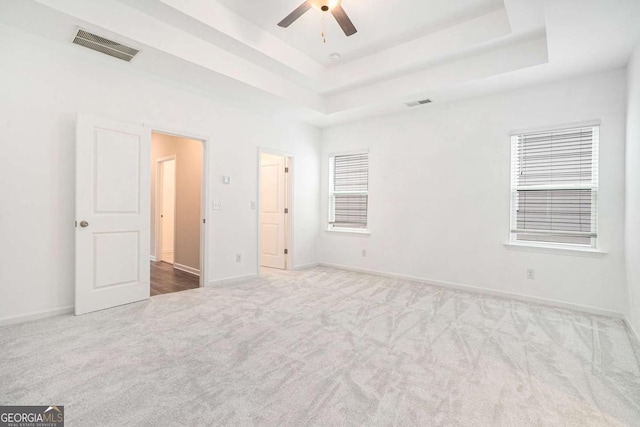 3514 Ambassador Aly, Scottdale, GA 30079 - unfurnished bedroom with a tray ceiling, carpet, visible vents, and baseboards