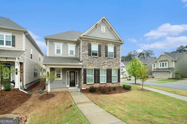 3514 Ambassador Aly, Scottdale, GA 30079 - traditional-style home with covered porch, roof with shingles, a front yard, stone siding, and a residential view