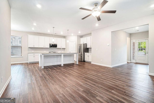 3514 Ambassador Aly, Scottdale, GA 30079 - unfurnished living room with ceiling fan, baseboards, dark wood-style floors, and recessed lighting