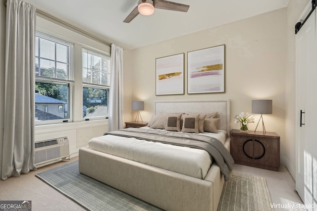 carpeted bedroom with a wall mounted air conditioner and ceiling fan