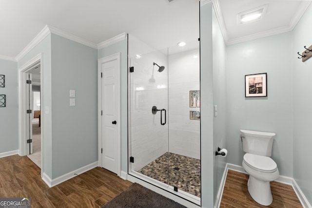 full bath with baseboards, wood finished floors, ornamental molding, and a stall shower