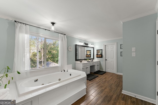bathroom featuring wood finished floors, a tub with jets, vanity, and crown molding