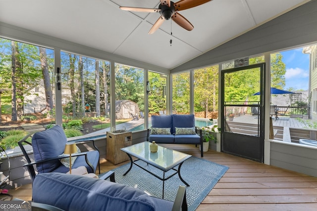 sunroom featuring outdoor lounge area and a ceiling fan