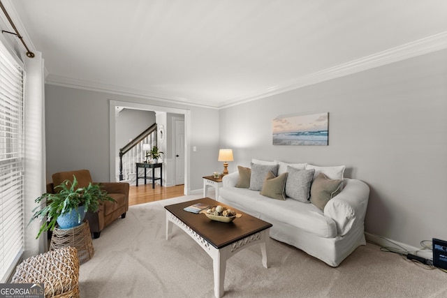 living area with baseboards, light colored carpet, stairway, and crown molding