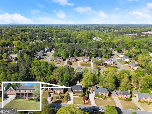 aerial view with a view of trees and a residential view
