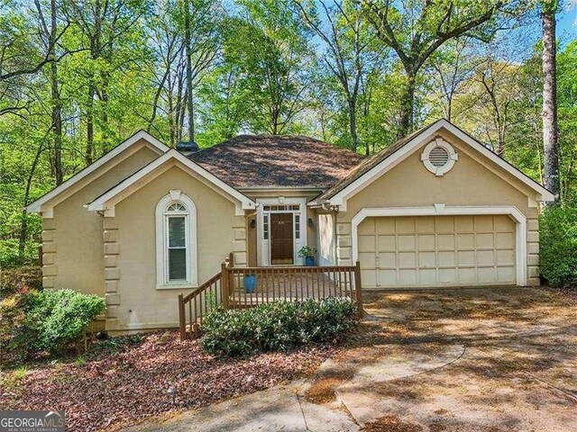 230 Oakmere Dr, Alpharetta, GA 30009 - ranch-style home with a garage, driveway, and stucco siding