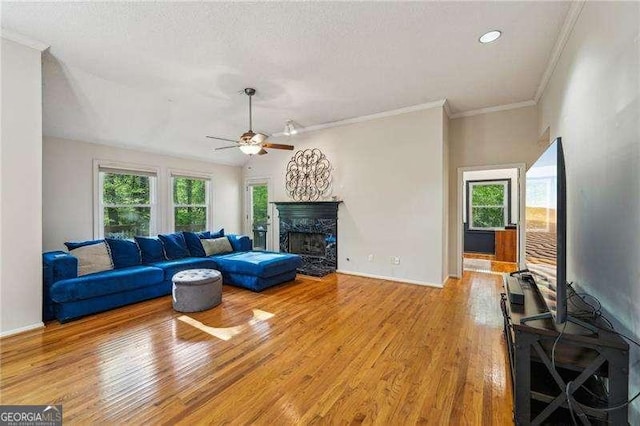 230 Oakmere Dr, Alpharetta, GA 30009 - living room with wood finished floors, ceiling fan, a high end fireplace, and baseboards