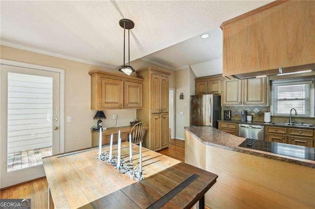 230 Oakmere Dr, Alpharetta, GA 30009 - kitchen with a sink, dark countertops, appliances with stainless steel finishes, light wood-style floors, and pendant lighting