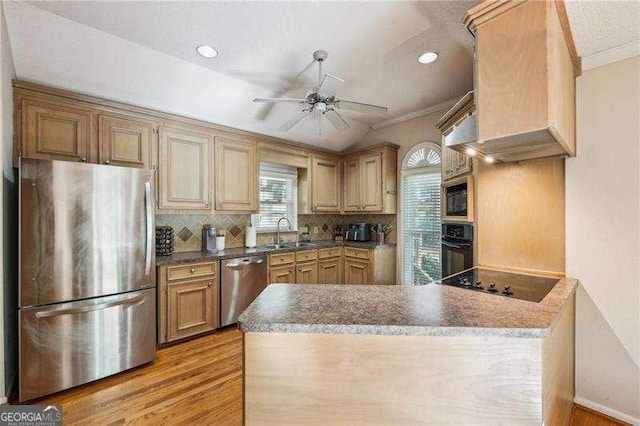 230 Oakmere Dr, Alpharetta, GA 30009 - kitchen featuring a sink, a ceiling fan, a peninsula, black appliances, and decorative backsplash