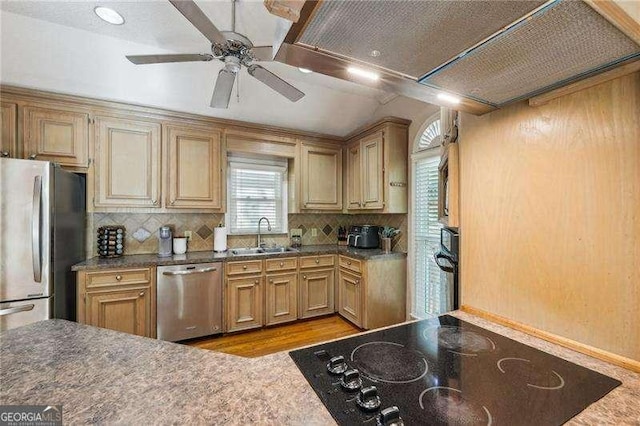 230 Oakmere Dr, Alpharetta, GA 30009 - kitchen with ceiling fan, light wood-type flooring, black appliances, a sink, and decorative backsplash