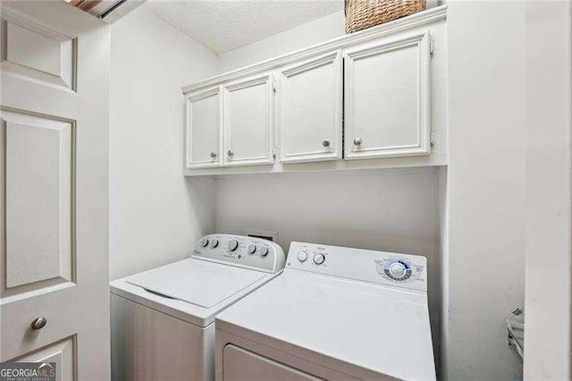 230 Oakmere Dr, Alpharetta, GA 30009 - clothes washing area featuring washer and dryer and cabinet space