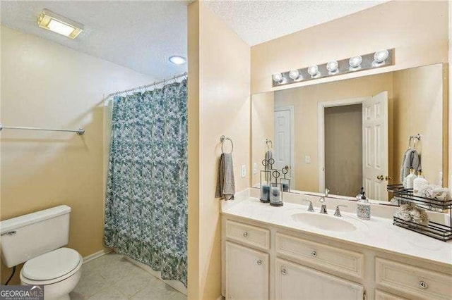 230 Oakmere Dr, Alpharetta, GA 30009 - bathroom featuring a textured ceiling, vanity, toilet, curtained shower, and tile patterned floors