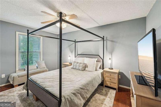 230 Oakmere Dr, Alpharetta, GA 30009 - bedroom featuring a textured ceiling, wood finished floors, ceiling fan, and baseboards